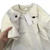 Camiseta Casual de Verano Suelta con Estampado de Graffiti y Letras para Mujer con Diseño de Nicho y Top Versátil para el Trabajo 2026
