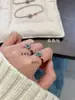 Nuevo Estilo Chino Flor Moneda Cuerda Roja Pulsera Benmingnian Guofeng Año Nuevo Pequeño Espectáculo Cuerda Blanca Tejida a Mano Regalo para Mujer