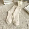 Calcetines gruesos de terciopelo de coral otoño e invierno forrados de felpa cálidos calcetines de postparto calcetines de felpa para dormir calcetines de tubo para el hogar calcetines de piso para mujer venta al por mayor