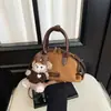 Bolso de hombro único de alta gama para mujer, nuevo y elegante, bolso cruzado simple, diseño de nicho, bolso de mano versátil, moderno