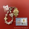 Llavero de tela con logo de empresa personalizado Cadena para teléfono móvil Angela Lámina de oro puro Oro 999 Regalo de aniversario