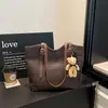 Bolsa de palha trançada estilo simples para mulheres, nova coleção 2026, bolsa de ombro de grande capacidade, bolsa de mão elegante e versátil
