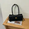 Bolso de hombro casual de nicho de alta gama nuevo 2026, bolso simple para debajo del brazo, bolso de mano retro moderno para mujer