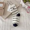 Nuevos calcetines coreanos de algodón peinado para otoño e invierno de Dongdaemun para mujer con bordado de dibujos animados de La Oveja Shaun, calcetines holgados de media pantorrilla a rayas