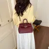 Elegante bolsa de mão preta platina para mulheres, novo modelo outono e inverno 2026, bolsa de mão de grande capacidade com padrão texturizado, bolsa tote para o dia a dia