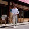 Pantalones de trabajo rectos de moda y versátiles con múltiples bolsillos para hombre, adecuados para primavera y otoño, con cintura ajustable con cordón, disponibles en stock