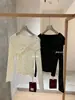 Wgwe8203 Guangzhou Trece Líneas Nuevo Top de Punto Fino de Manga Larga con Lunares Estilo Suave Otoño/Invierno para Mujer