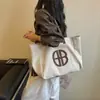 Bolsa casual de lona de nylon para mulheres, bolsa tote estudantil de grande capacidade para a aula, bolsa tote de ombro simples e versátil para o dia a dia.