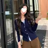 Fórmula de look: Cardigã de malha com gola polo color block, modelo fino para mulheres, primavera e outono, top estiloso de manga longa 2026