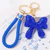 Llavero de Arco de Arcilla Cordón de Cuero Pequeño Regalo Pedrería Colgante de Llave de Metal Yiwu Pequeño Artículo Mayorista Transfronterizo