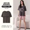 Conjunto de pijama de algodón para mujer de verano en stock con mangas cortas, shorts, copas en el pecho, cuello redondo, diseño lindo de caricatura, ropa casual para el hogar