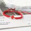 Pulseira de nó chato trançada de trevo de quatro folhas, best-seller transfronteiriço para casais e estudantes, tendência europeia e americana inspirada em dopamina, joias atacado de fábrica