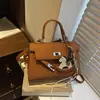 Exquisito Bolso Kelly para Mujer 2026 Nuevo Diseño de Marca Pequeña Sensación de Alta Gama Bolso de Hombro Único Cruzado Bolso de Mano Retro