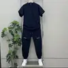 Novo Conjunto Masculino de Verão em Seda Gelada de Secagem Rápida Tendência Masculina com Meio Zíper Gola Alta Malha Manga Curta Calça Casual Conjunto de Duas Peças