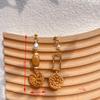 Aretes tejidos de ratán de hierba hechos a mano estilo bohemio de vacaciones aretes de playa junto al mar aretes colgantes redondos geométricos para mujer