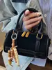 Bolso de Mano Boston Estilo Coreano Estampado de Leopardo Nicho para Mujer Verano 2025 Nuevo Bolso de Hombro Cruzado Retro Bolso Almohada