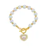 Moda retro europea y americana pulsera de perlas de lujo ligero colgante de corazón incrustado de diamantes hebilla de langosta pulsera de temperamento para dama venta al por mayor