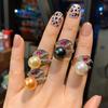 Agita para desear anillo de apertura de perla de Fritillaria madre australiana Joyería al por mayor para mujer combinación de corindón rojo y perla