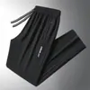 Calças masculinas para primavera e outono, calças casuais da moda com bolsos com zíper, calças esportivas jogger retas largas