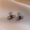 Pendientes de Ojo de Tigre Maillard Otoño e Invierno para Mujer, Pendientes de Botón Elegantes con un Toque de Lujo, Lujo Ligero, Nuevos Accesorios Populares para Orejas 2026
