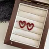 Simple Temperament Angla Red Hollow Love Brincos 2024 Novos Explosões Design Sense Brincos Femininos