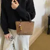 Bolso Cubo Portátil Retro de Moda para Mujer Otoño/Invierno 2026 Nuevo Bolso de Hombro Simple Casual Versión Coreana Bolso de Mujer de Alta Gama