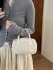 Coleção de outono 2026 transfronteiriça: bolsas de ombro estilosas e da moda, bolsas tote únicas e chiques, e bolsas transversais retrô de nicho