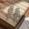 Pendientes europeos y americanos transfronterizos con borlas incrustadas de diamantes, lujo ligero, alta gama, modernos, diseño simple y único, pendientes versátiles