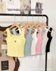 Camiseta Regata Quadrada com Laço Estilo Coreano Mais Vendida com Bojos, Alças Largas, Efeito Emagrecedor, Adequada para Usar em Camadas ou Sozinha, Top Doce e Estiloso