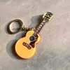 Nuevo llavero acrílico de alta calidad de suministro directo, llavero creativo de violín, colgante para bolso con impresión de logotipo