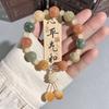 Pulsera de bodhi de flor flotante en polvo natural para hombres y mujeres camelia anillo individual pulsera de mano cuentas cuentas texto placa de juego cuerda venta al por mayor