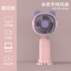 2024 nuevo creativo Mini ventilador de mano pequeño para niños estudiante portátil interfaz de carga USB ventilador al por mayor