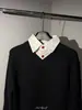 Suéter tipo polo de punto de alta gama con cuello en V, diseño de dos piezas falsas para hombre, diseño de otoño e invierno, tejido elegante para parejas
