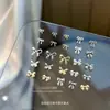 Accesorios de aleación para arte de uñas personalizados, tamaños mixtos, moños y cintas de metal, accesorios de uñas portátiles para DIY, venta al por mayor en grandes cantidades
