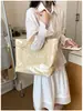 Bolsa de ombro única feminina design de nicho senso de estilo couro macio bolsa feminina grande capacidade para o dia a dia temperamento bolsa tote simples feminina transfronteiriça