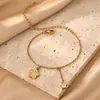 Tobillera con Colgante de Flor Cadena de Acero Inoxidable Chapada en Oro de 18 Quilates Joyería de Circonita Estilo Festivo de Venta Caliente Transfronteriza Europea y Americana Joyería para el Pie