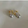 ¡Sensación de flotación súper hermosa! Versátiles Aretes Redondos de Perla de Vidrio de Alto Brillo 2026 Aretes de Perla Gris Cristalina de Alta Gama para Mujer