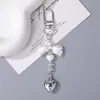 Chaveiro de Pingente Pequeno com Contas de Laço de Coração Prateado Pingente Pequeno DIY Artesanal Estilo Coreano Charme de Bolsa Ornamento de Corrente de Celular
