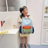 Mochila de viaje para niños de color contrastante, gran capacidad, nuevo estilo de verano 2026, simple, a la moda, versátil, mochila escolar pequeña