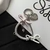 Cadena de hueso de serpiente de cable telefónico nueva y creativa con lazo personalizado, decoración versátil para bolso y accesorio para funda de teléfono
