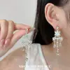 Pendientes elegantes y delicados de estilo francés con diamantes brillantes, diseños florales y de lágrima, y borlas para mujer; moderno, simple, de nicho y versátil