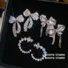 Belleza en el corazón de ello: Pendientes de borlas con lazo de piedras preciosas, sensación de lujo ligero y alta gama, pendientes de terrón de azúcar y luna creciente para mujer