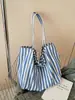 Bolso de lona a rayas verticales simple artístico estilo coreano, gran capacidad, bolso de hombro casual y versátil para mujer, transfronterizo
