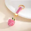 Pingente de chaveiro de carro de maçãzinha tridimensional cravejada de diamantes transfronteiriço, acessório versátil para bolsas femininas, toque de luxo, pequeno presente