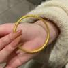 El círculo Nezha Gankun hereda el antiguo círculo Fa Su Bauhinia patrón rollo pulsera sólida corte