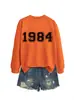 Amazon eBay sitio independiente casual simple cómodo mujer 1984 digital otoño e invierno nuevo cuello redondo manga larga sudadera