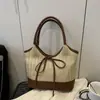 Bolsa de Ombro Feminina Verão 2025 com Laço Sob o Braço Moda Casual Grande Capacidade Bolsa de Mão Nicho Palha Cor Contrastante Bolsa de Ombro