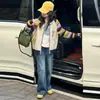 Traje de Niña Otoño e Invierno 2025 Nuevo Conjunto de Dos Piezas de Cardigan de Punto Otoñal para Niña Pantalones de Pierna Ancha de Mezclilla para Niña