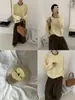 Outono 2026 Novo Suéter de Malha Feminino Top Estilo Coreano Elegante Cor Sólida Lã Pura Gola Redonda Manga Longa para Trabalho Casual Versátil
