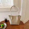 Bolso de mujer de gran capacidad 2026 nuevo modelo de verano, bolso de mano tejido de patrón simple de alta gama, bolso de hombro, bolso tipo cubo para madre e hijo